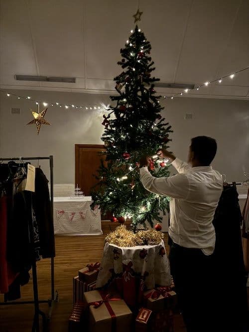 Decorating the Christmas tree in the hall